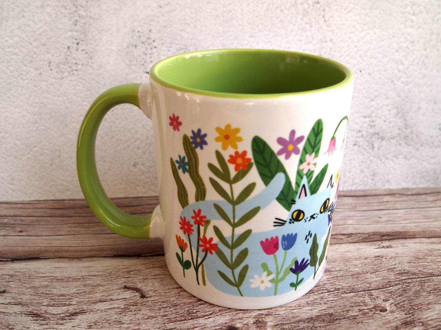 Colourful cats with flowers illustrated coffee mug