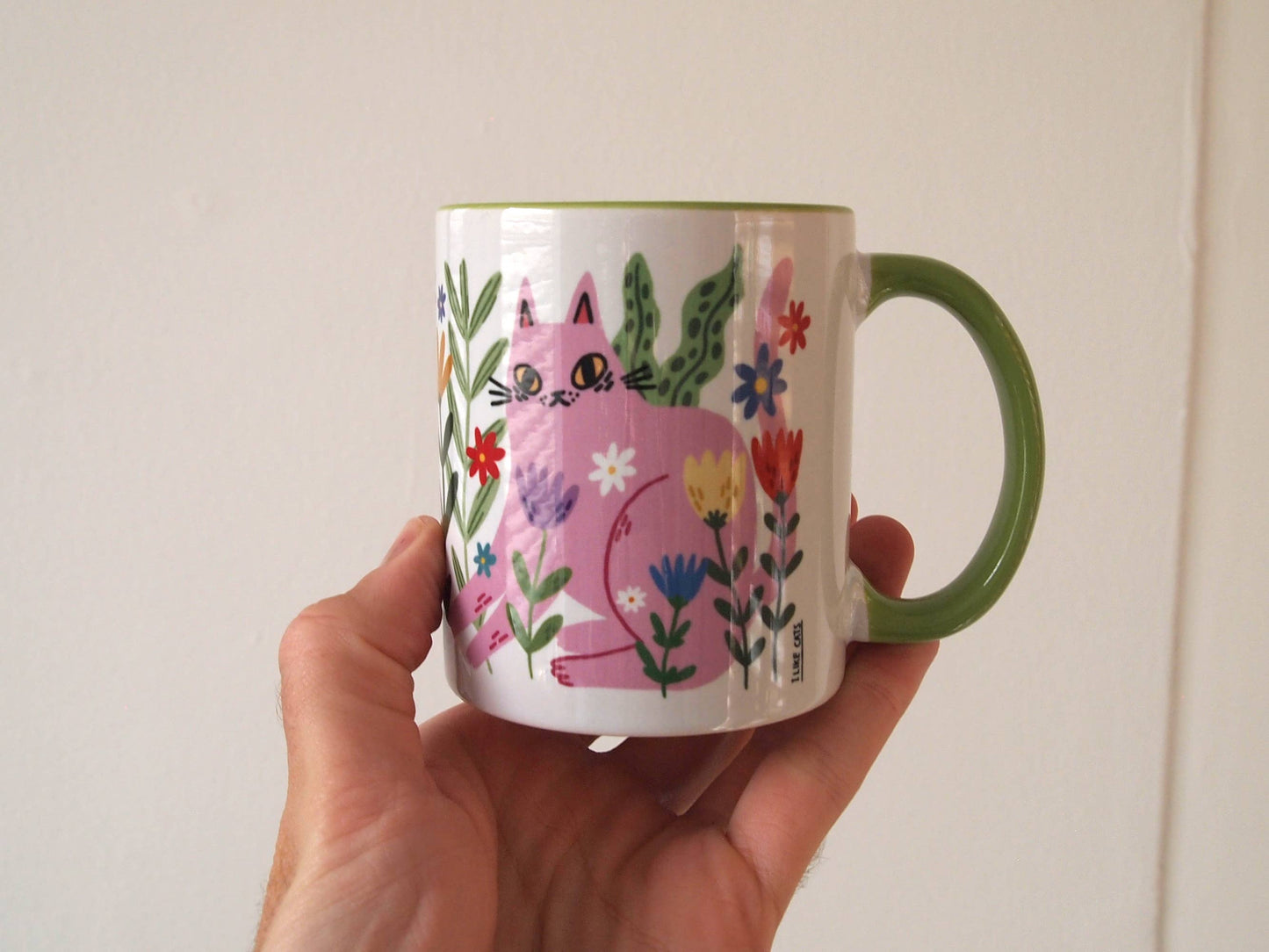 Colourful cats with flowers illustrated coffee mug