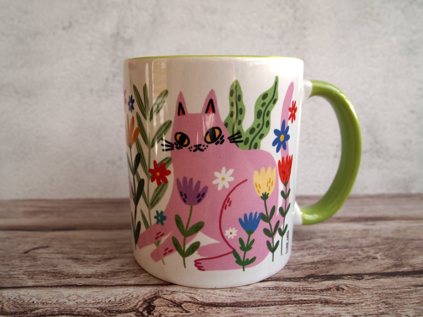 Colourful cats with flowers illustrated coffee mug