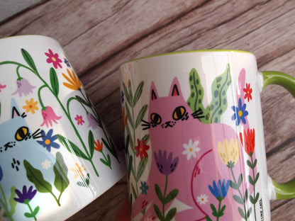 Colourful cats with flowers illustrated coffee mug