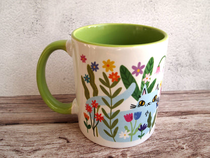 Colourful cats with flowers illustrated coffee mug