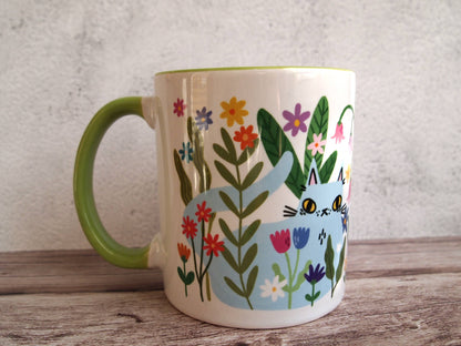 Colourful cats with flowers illustrated coffee mug