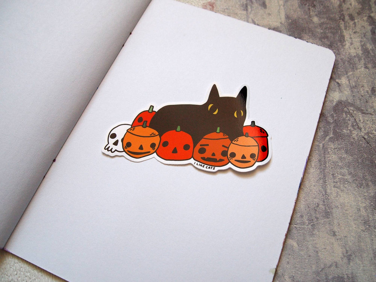 Black cat with pumpkins illustrated vinyl sticker