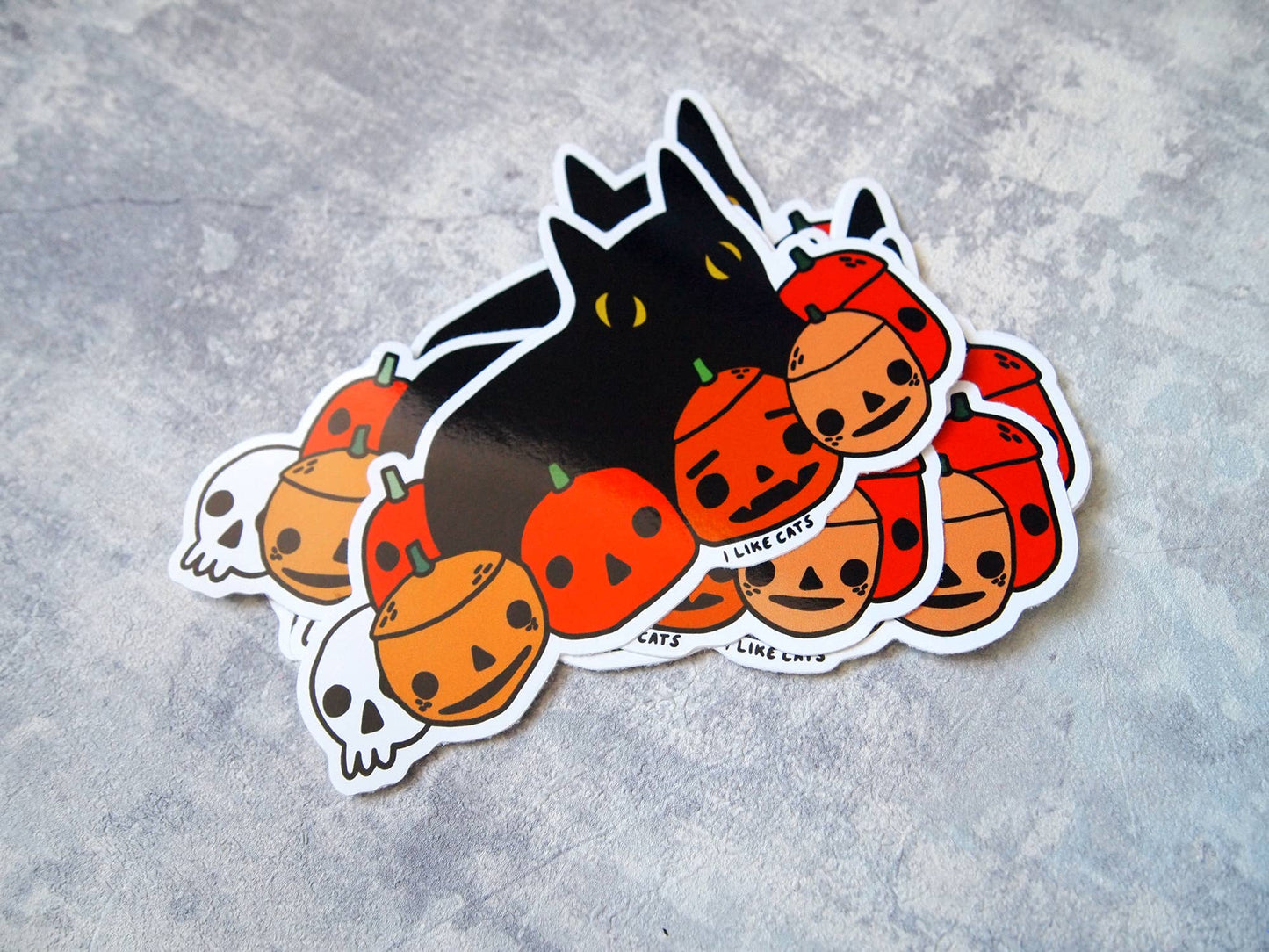 Black cat with pumpkins illustrated vinyl sticker